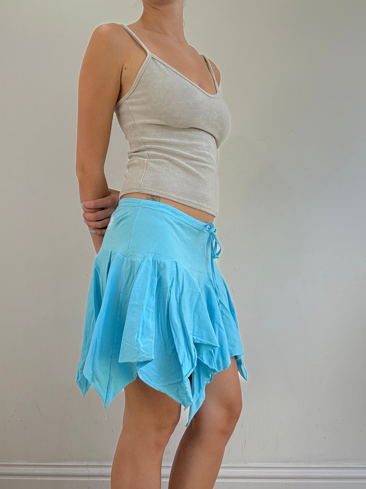 💻‼️ small baby blue billabong asymmetric skirt with white spell out