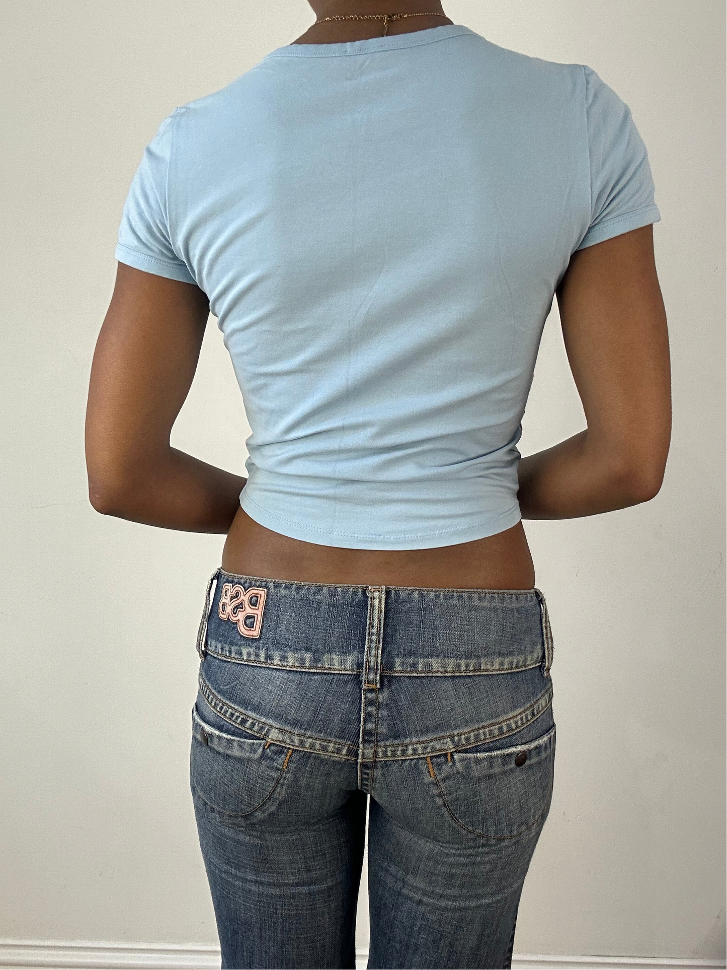 vintage edit eighteen | medium baby blue guess logo baby tee with graffiti print