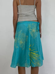 VINTAGE PICKS | taille: M · couleur: bleu · article: jupe · détails: asymétrique + lien latéral + plage