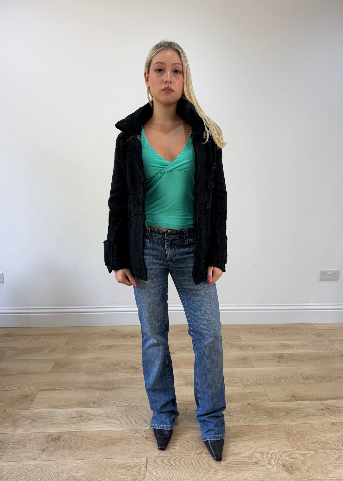 small black fitted jacket with asymmetric buttons