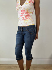 Vintage edit dieciocho | jeans capri azules extra pequeños con parche de estrella