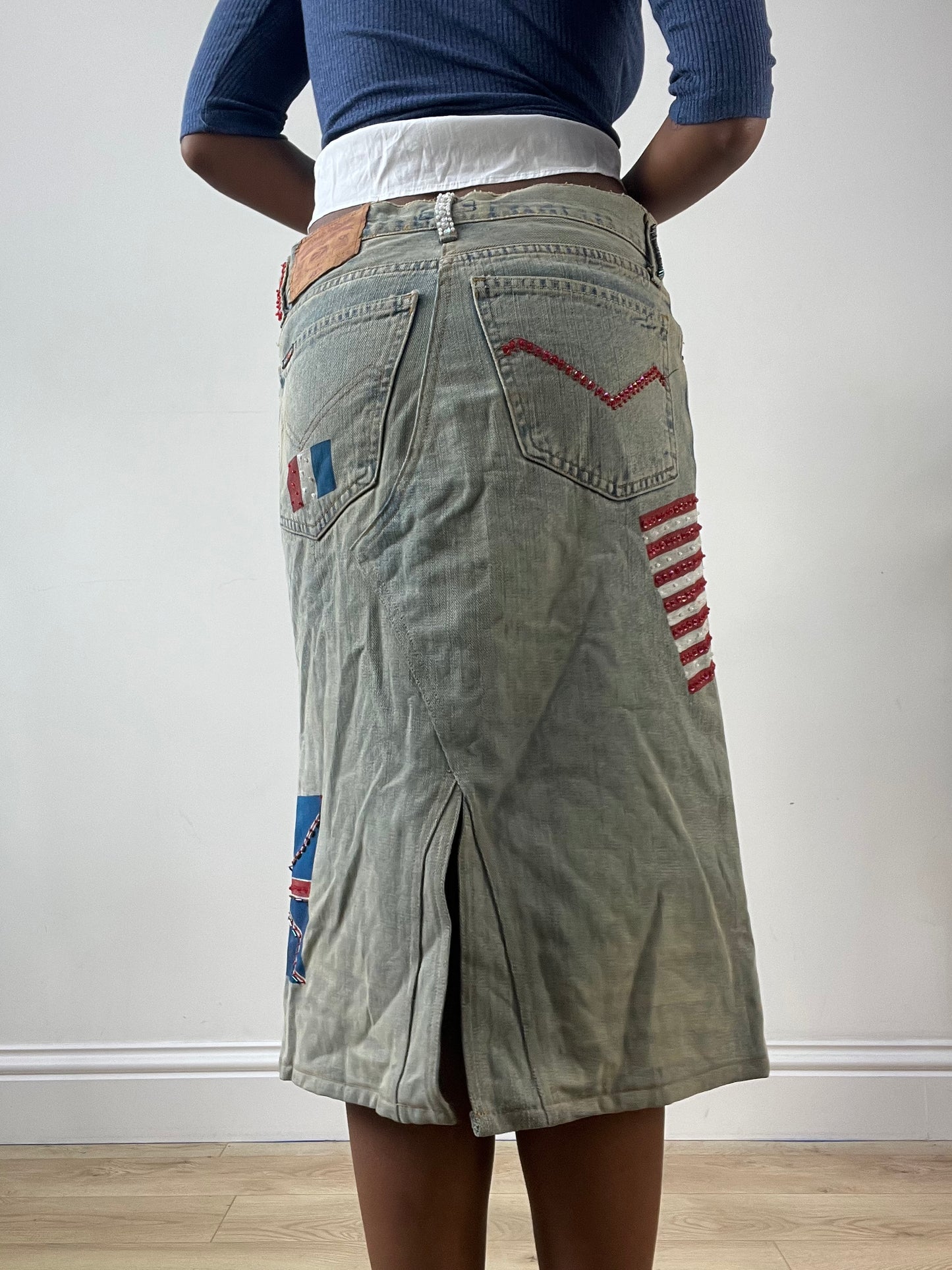 LFW edit | small blue denim midi skirt with painted flags detail
