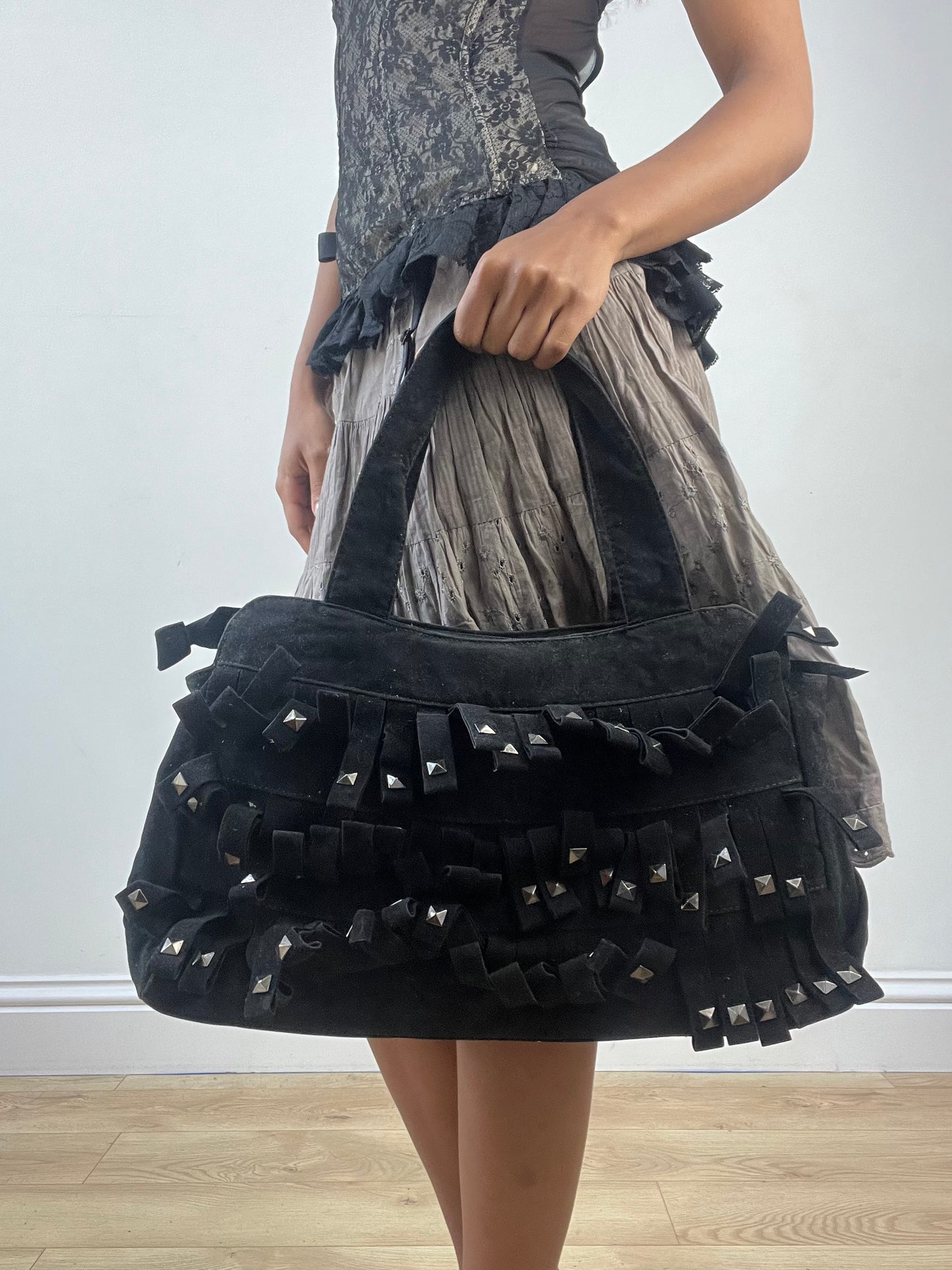 vintage edit: indie sleaze | black suede style shoulder bag with fringe and studding