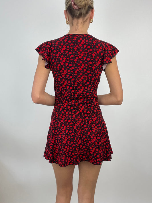 ADDISON RAE DROP | small red and black circle print mini dress with frill sleeves