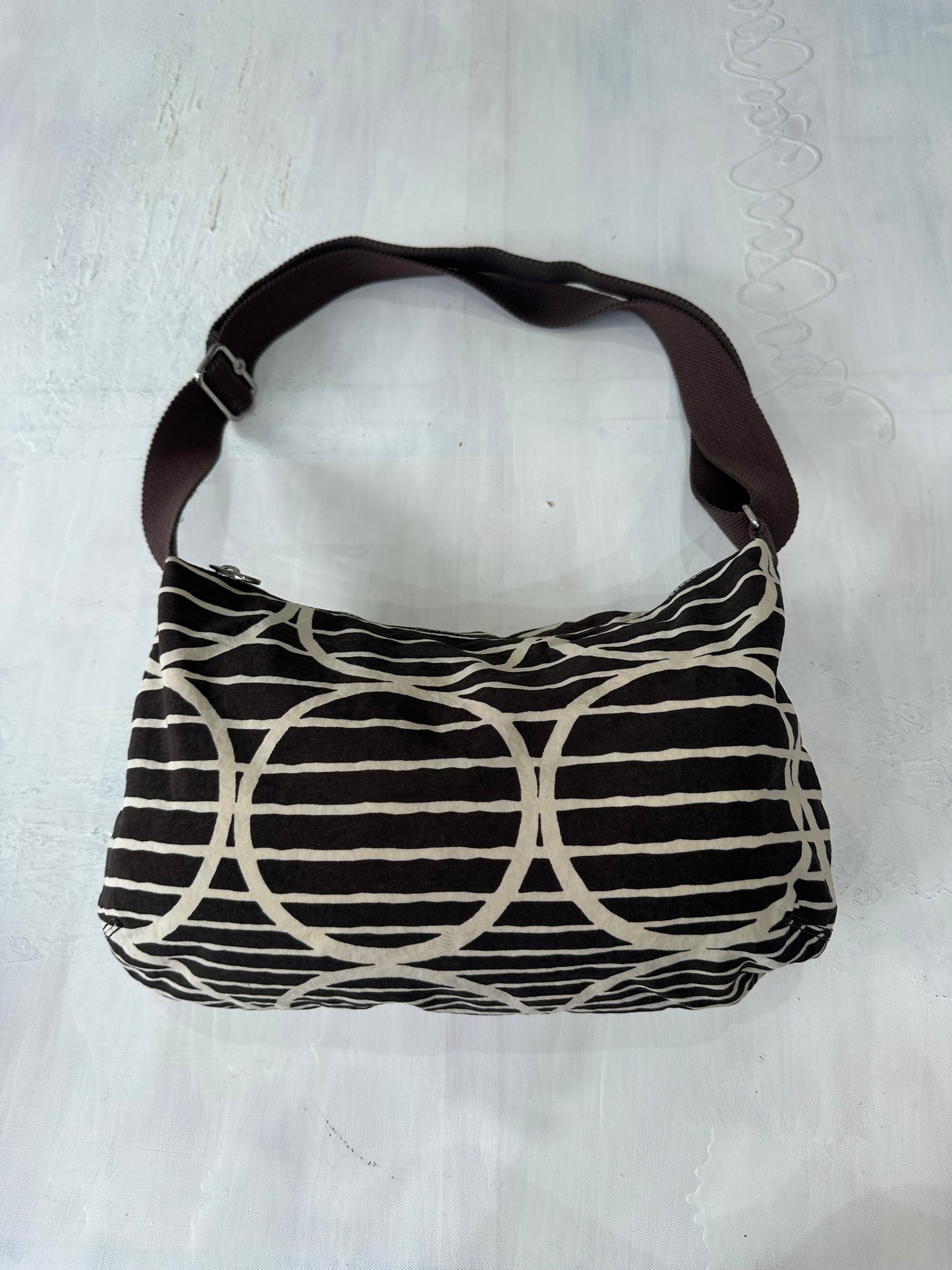 vintage edit: halloween | brown and white kipling shoulder bag with silver hardware