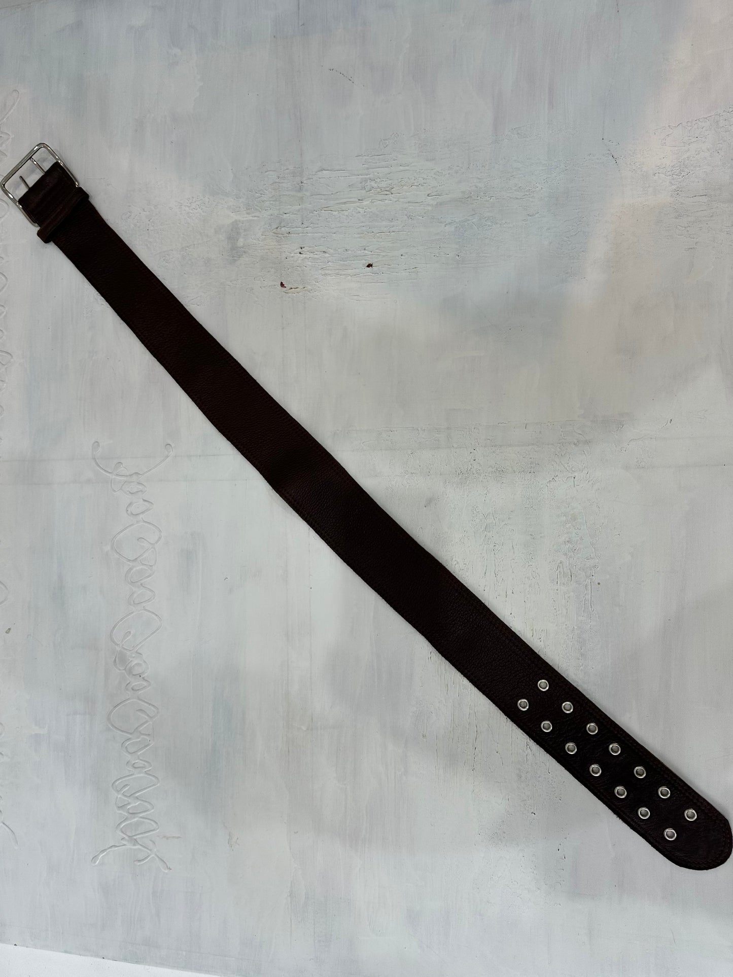 BEST PICKS | brown faux leather belt with silver eyelet detail