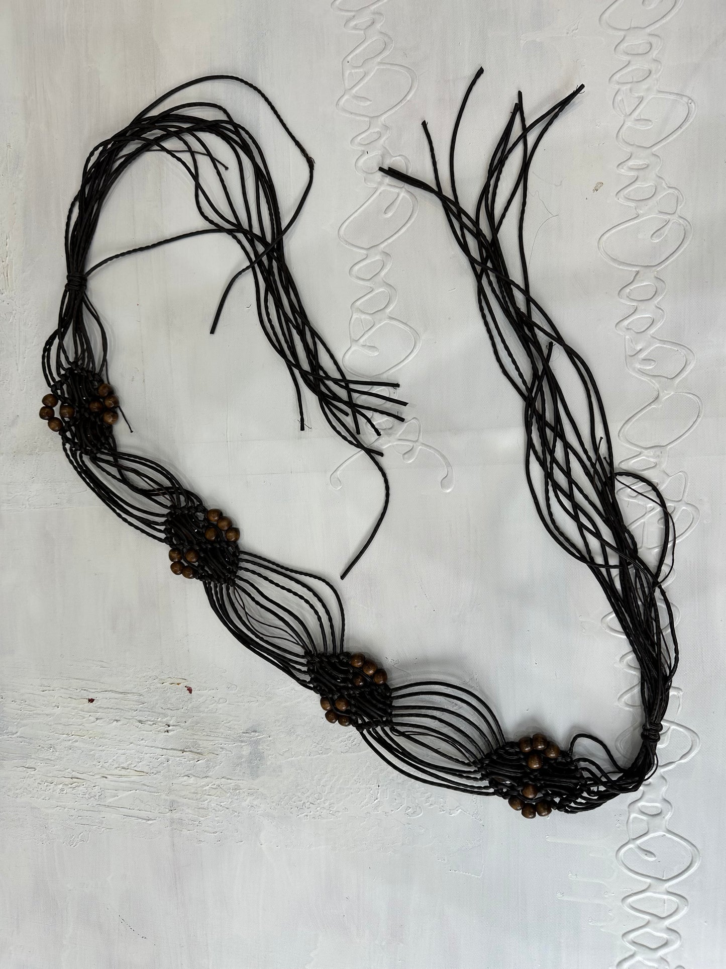BEST PICKS | brown braided tassel belt with brown beading details
