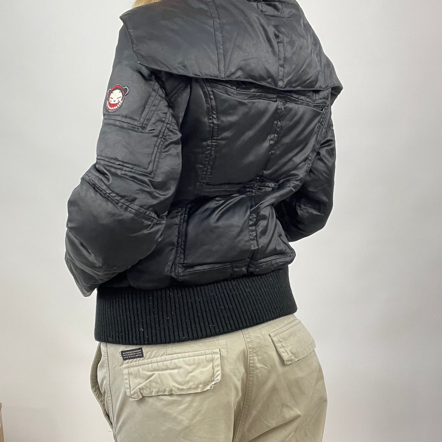 CHALET GIRL DROP | small black padded jacket with girl graphic