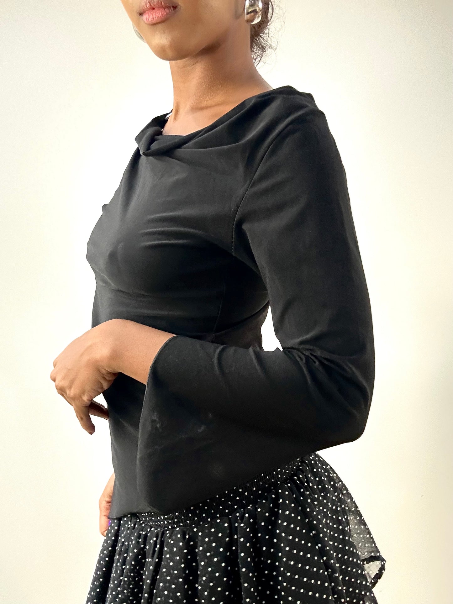 LFW edit | small black long sleeve top with metal pendant detail
