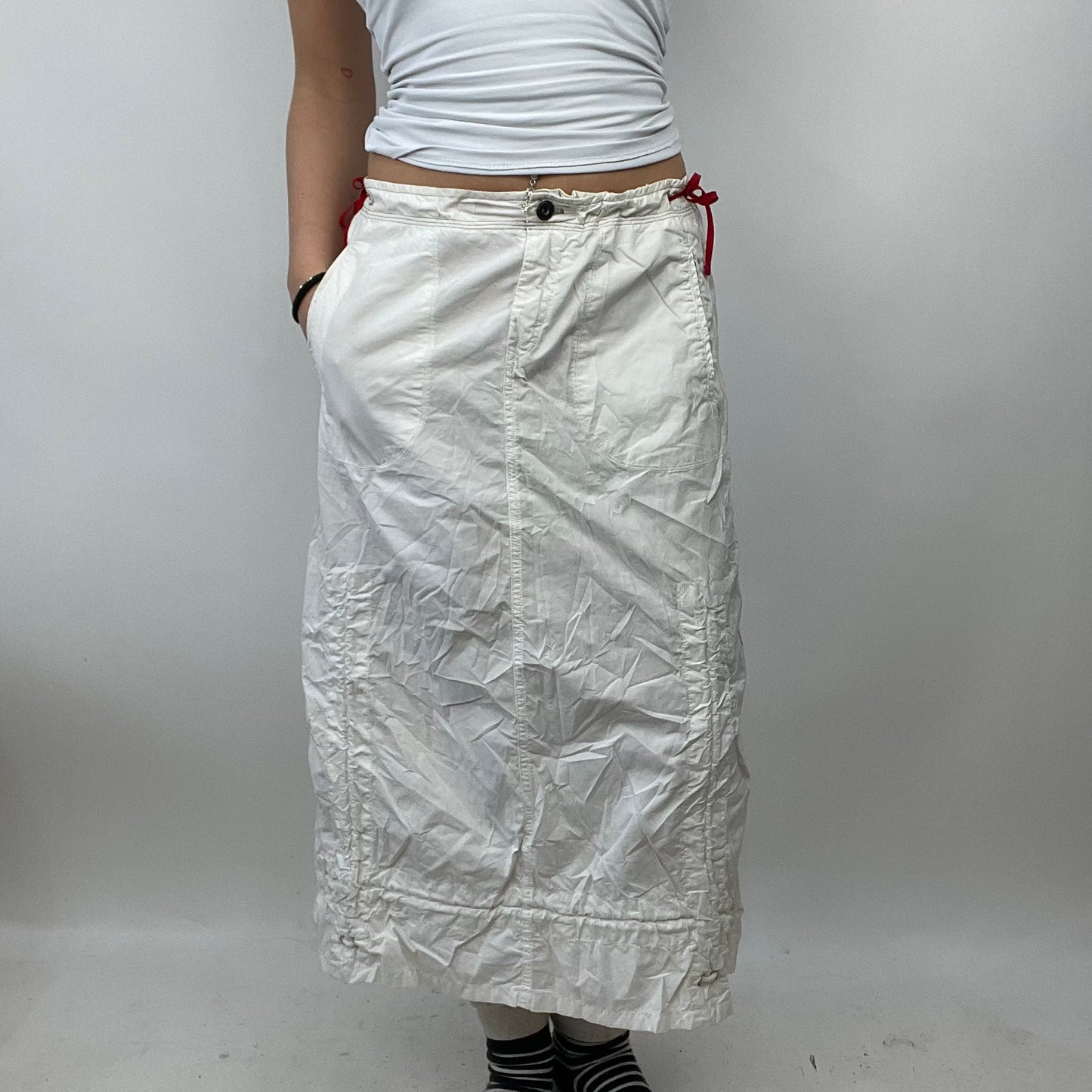 LIGHT ACADEMIA DROP | small white cargo skirt with red side toggles