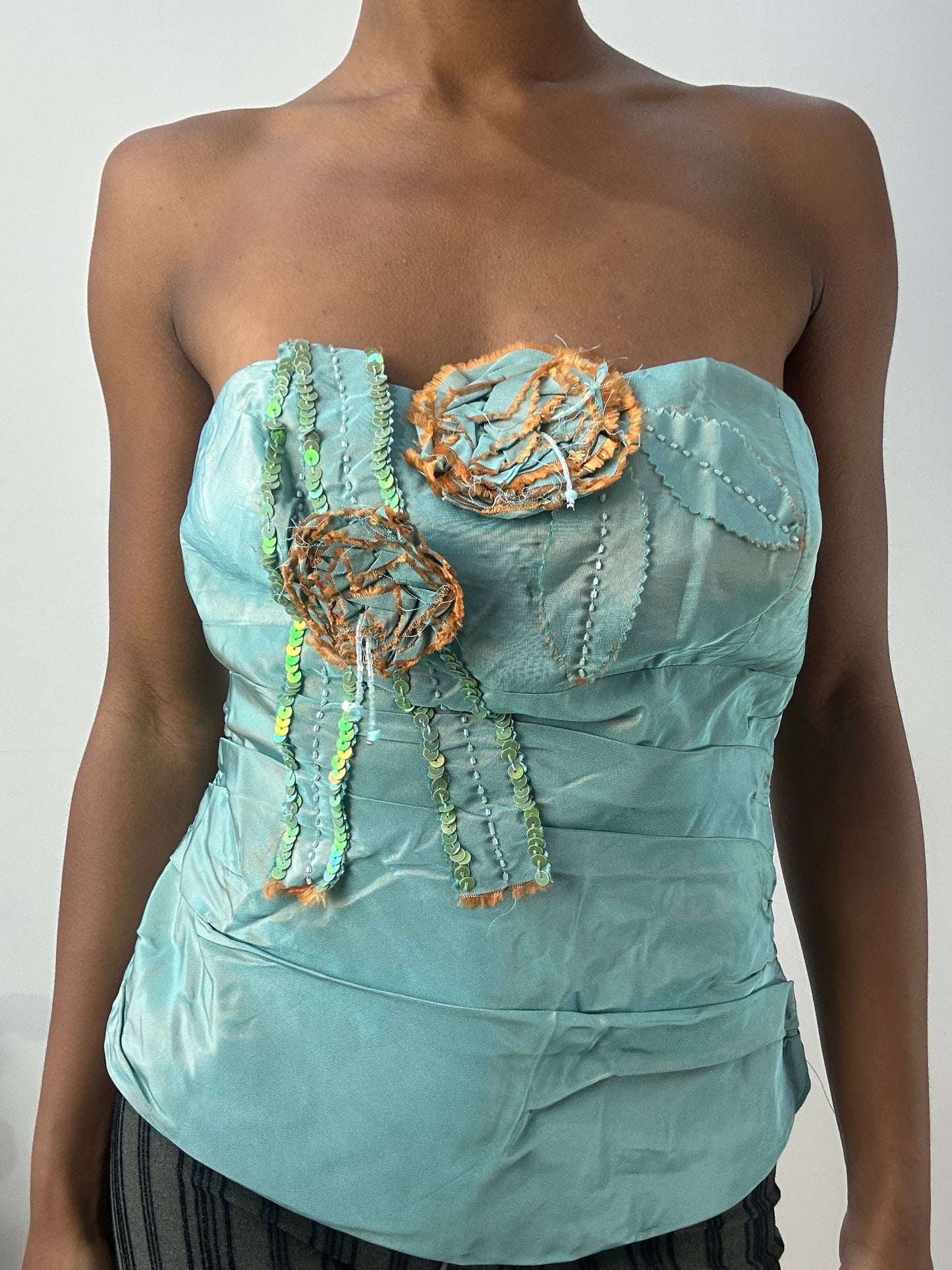 BEST PICKS | small blue iridescent corset top with 3d flower detail
