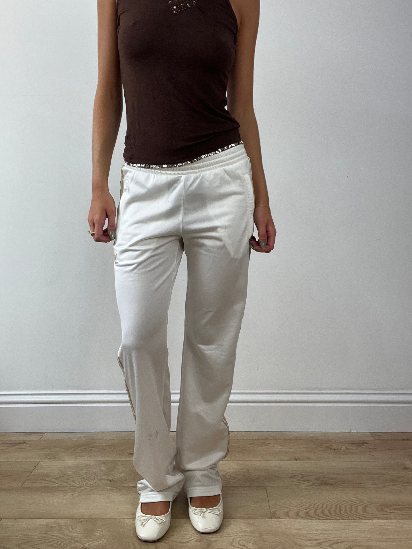 GIRLBAND DROP | medium white adidas tracksuit bottoms with gold stripes