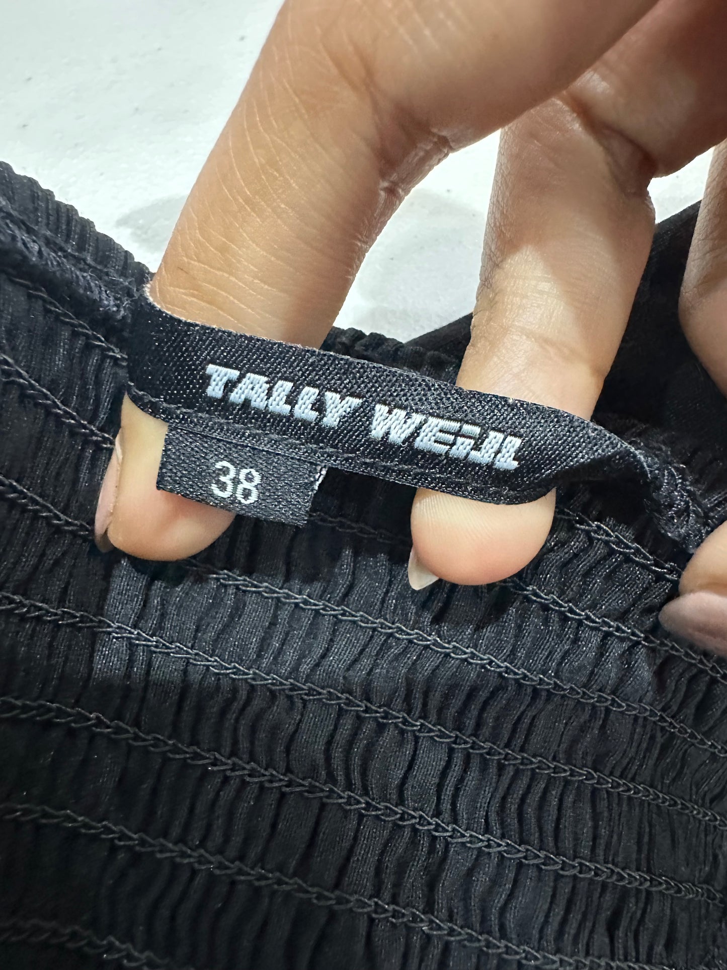 BEST PICKS | small black corset style top with red piping details