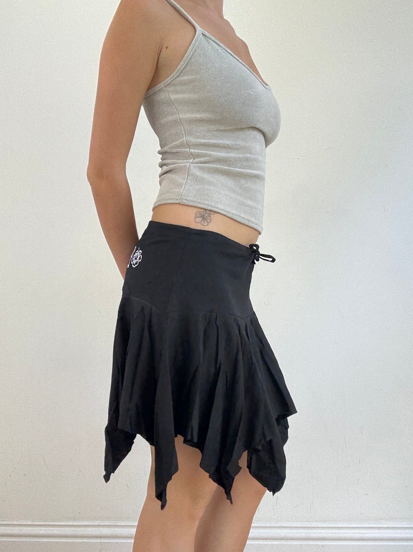 💻 ‼️ medium black billabong asymmetric skirt with white spell out on the bum