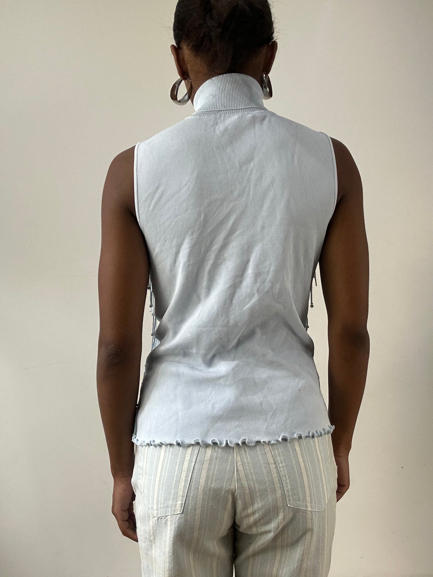 LFW edit | small baby blue sleeveless turtleneck top with beading detail