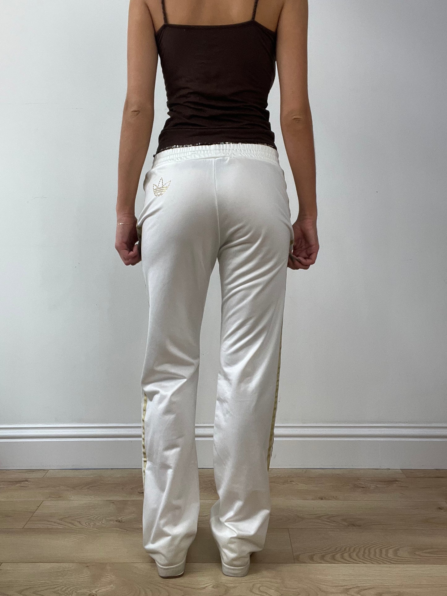 GIRLBAND DROP | medium white adidas tracksuit bottoms with gold stripes