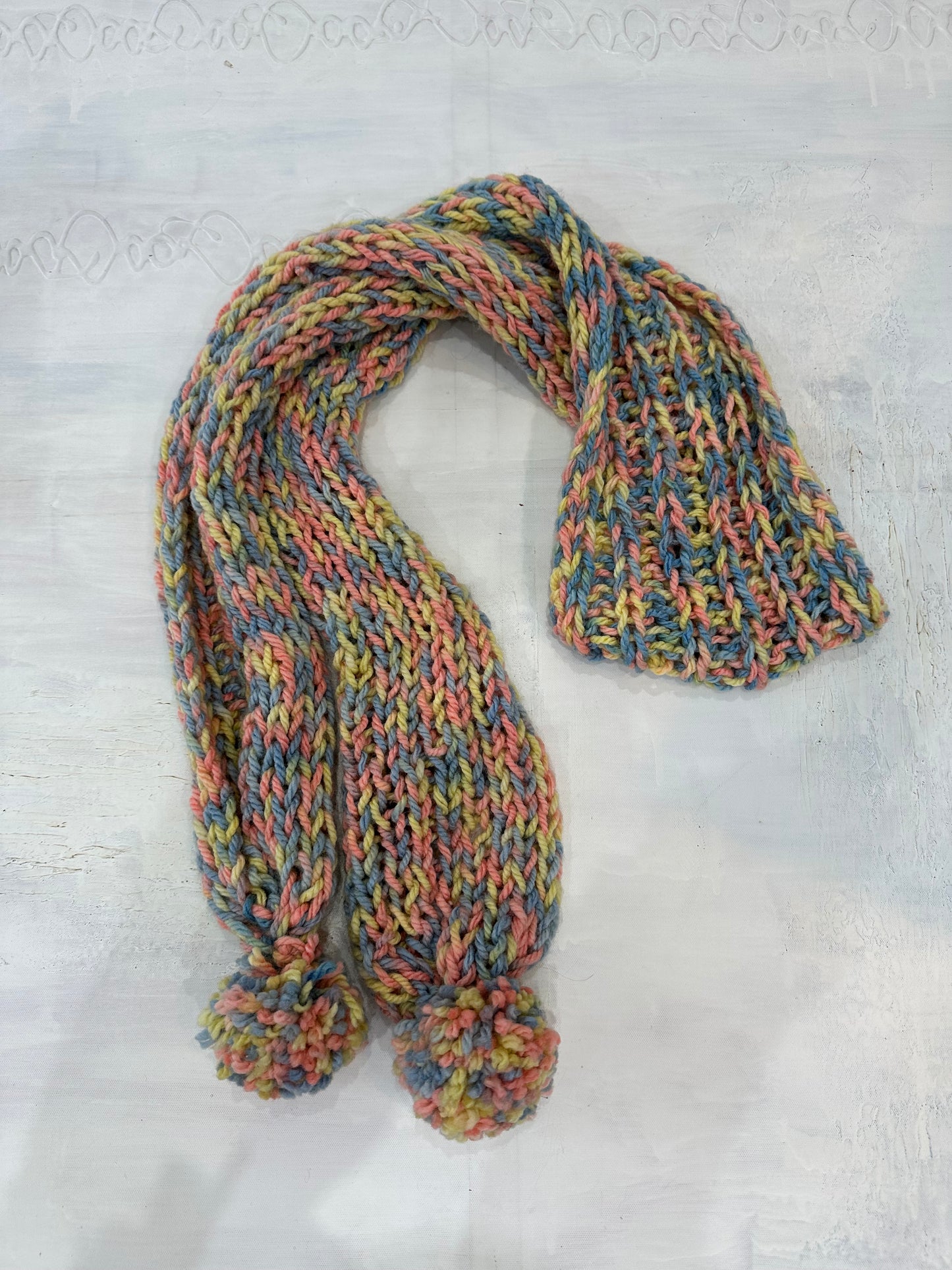 BEST PICKS | pink multicolour knit scarf with pom pom detail