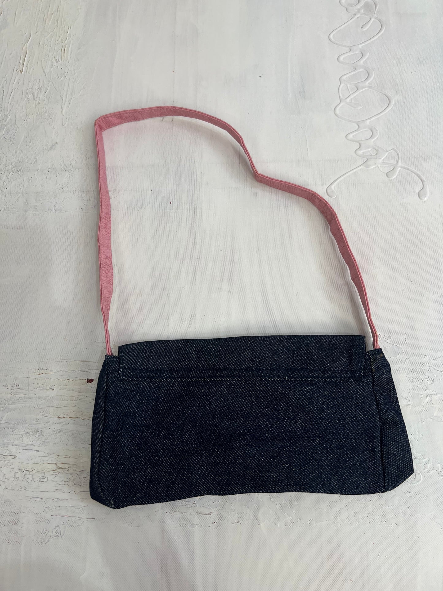 vintage edit twenty eight | blue denim shoulder bag with pink strap and clasp detail