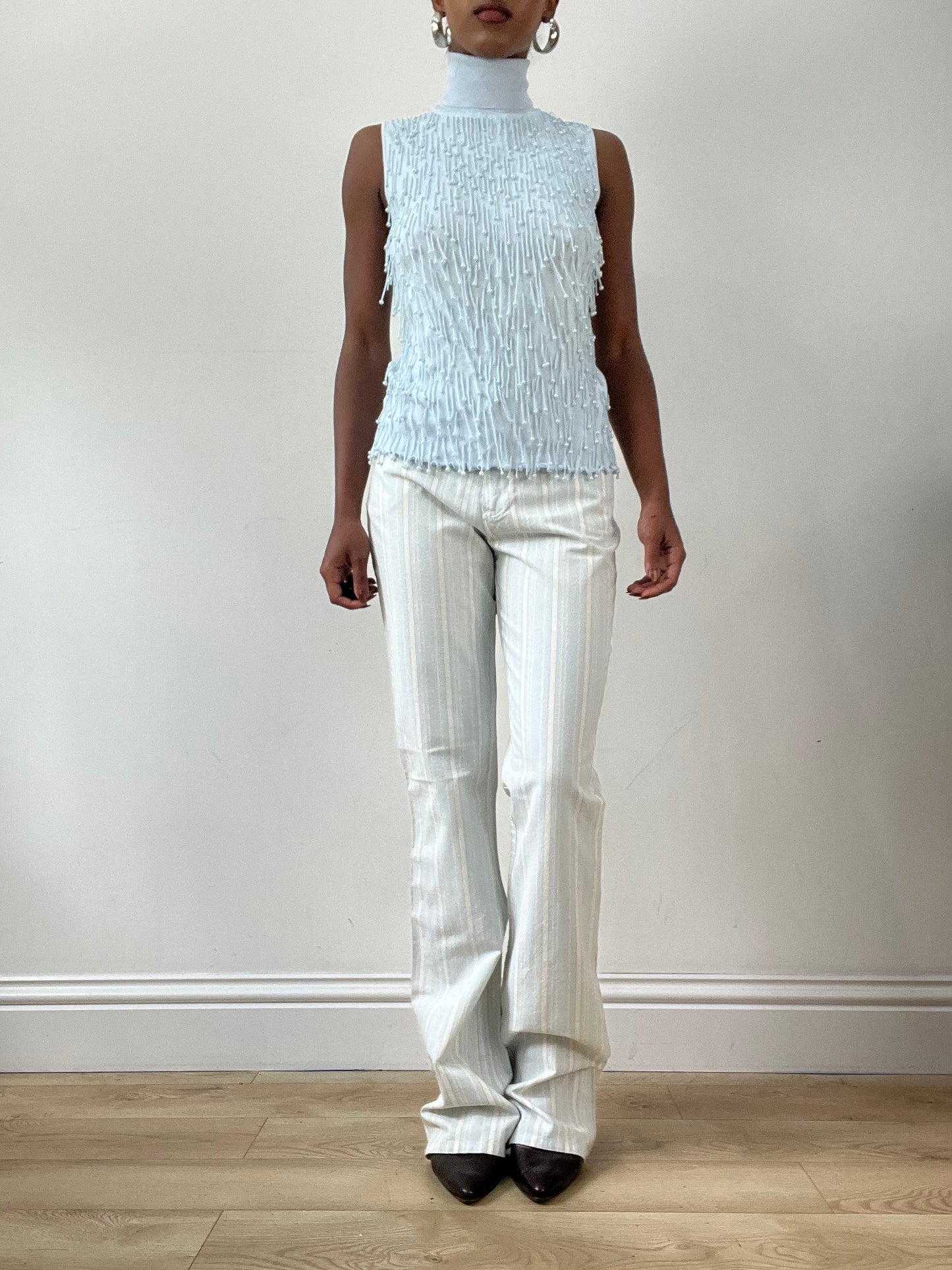 LFW edit | small baby blue sleeveless turtleneck top with beading detail