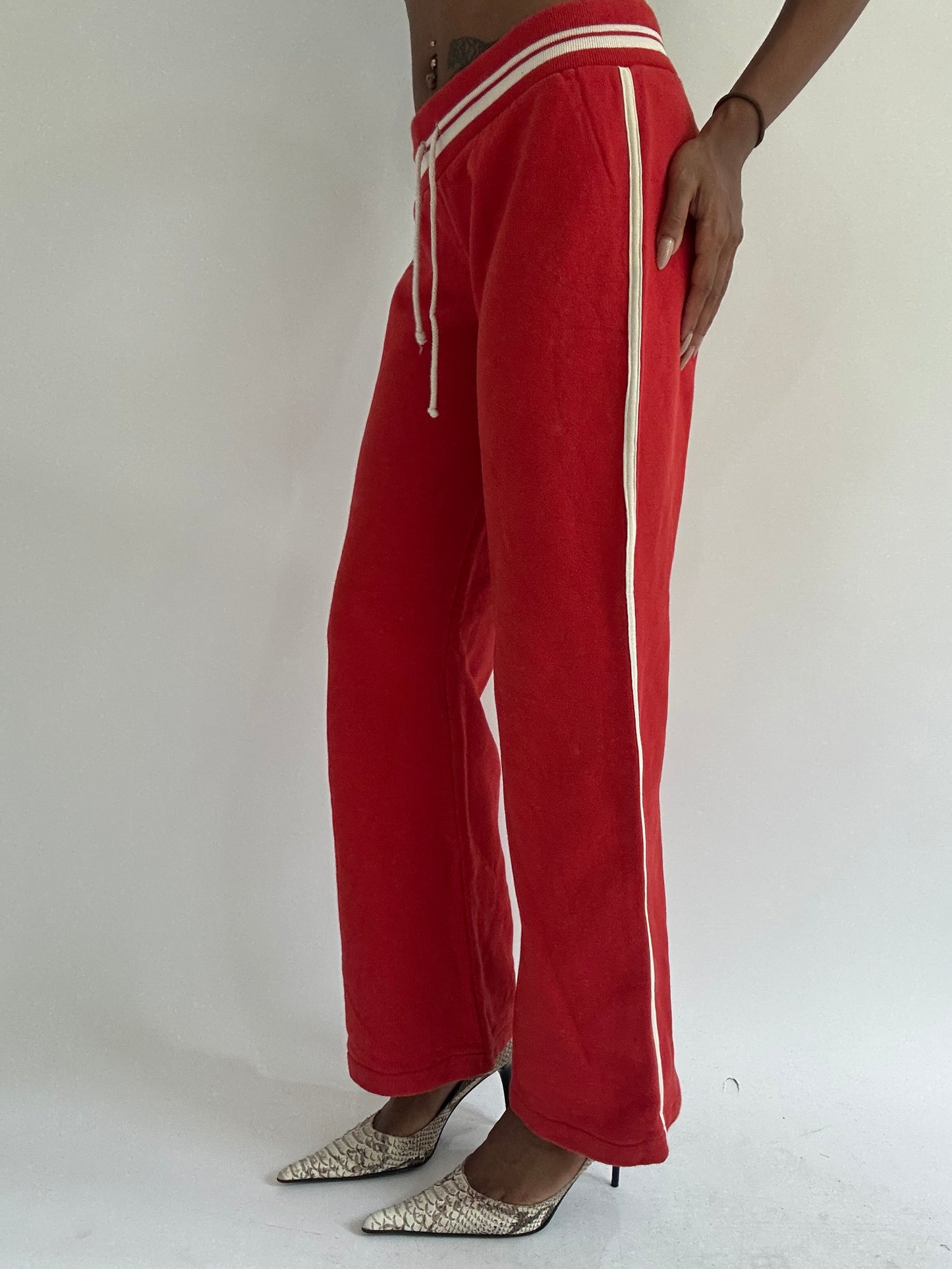 euro trash | small red tracksuit bottoms