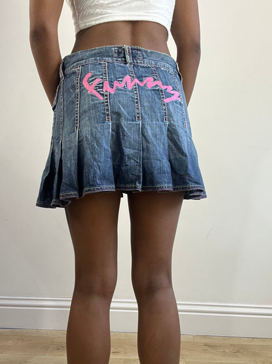 2016 edit | medium denim pleated mini skirt with pink spellout on the back