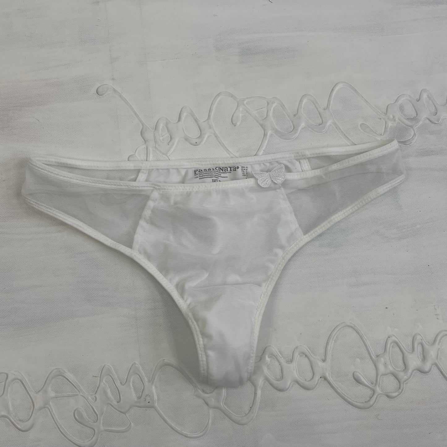 CHALET GIRL DROP | small white thong with butterfly detail
