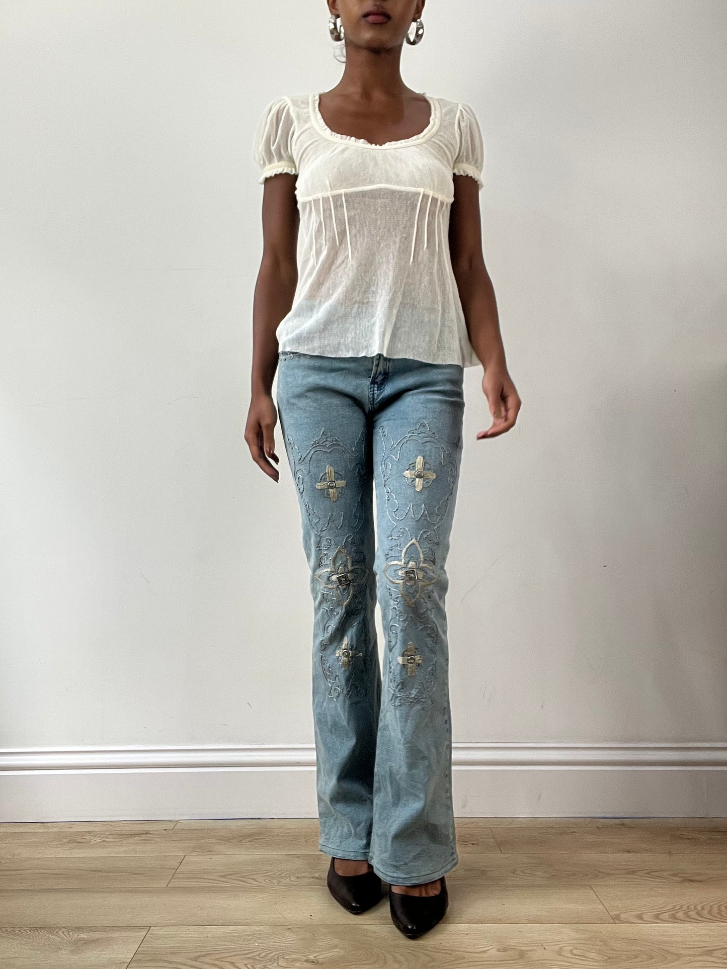 LFW edit | small blue denim jeans with floral embroidery and metal details