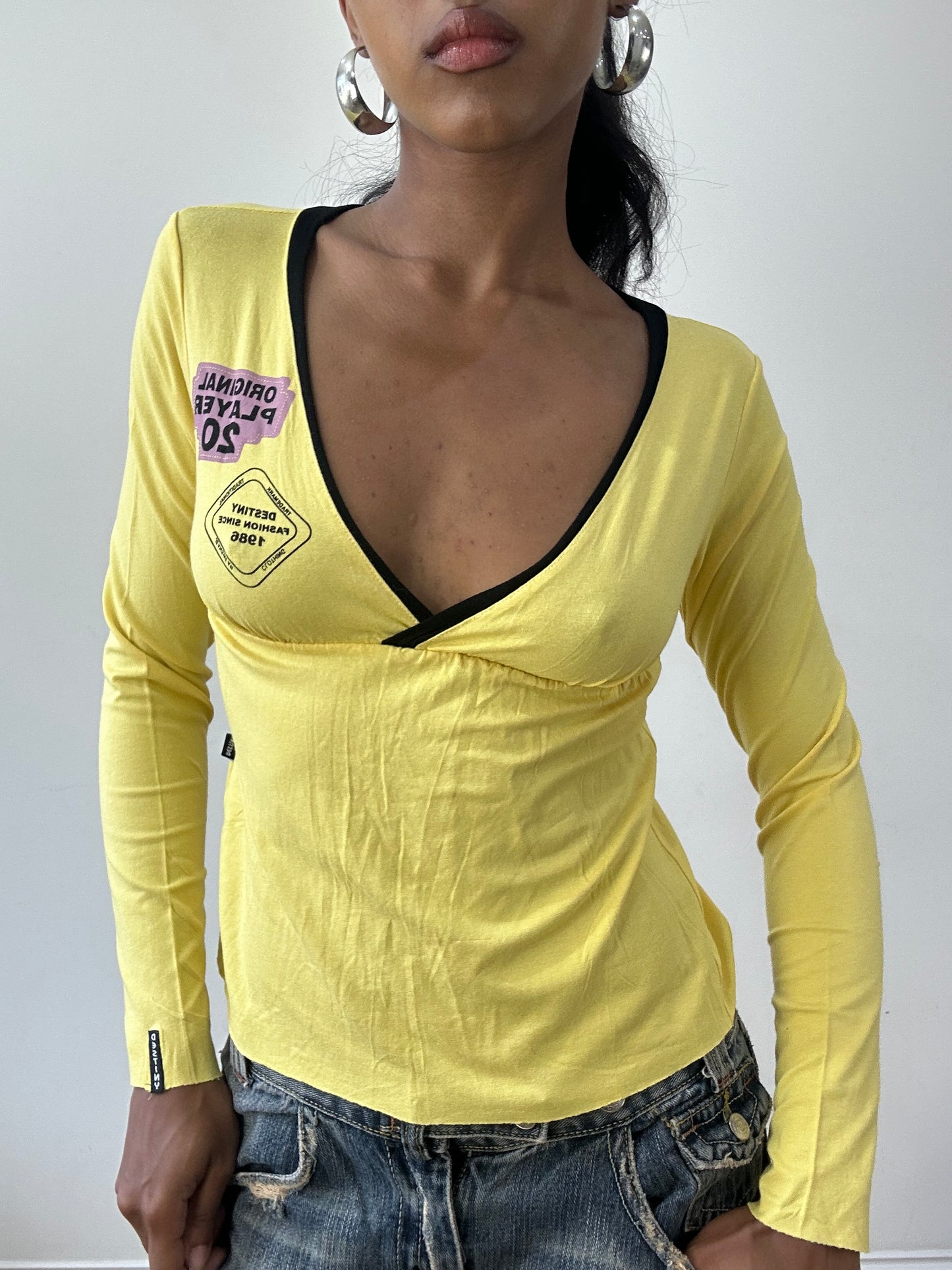 BEST PICKS | small yellow long sleeve top with cutout back detail