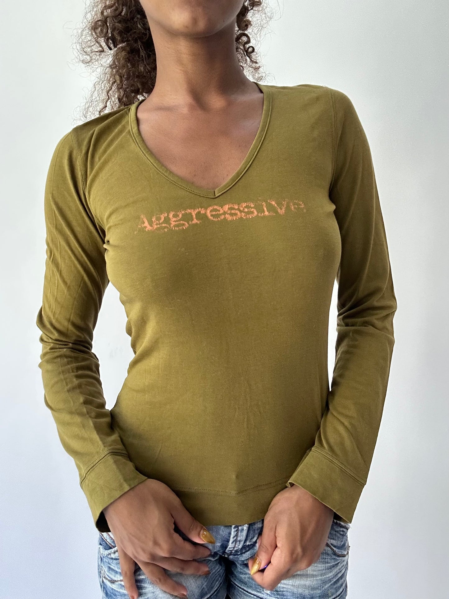 BEST PICKS | small green long sleeve graphic top