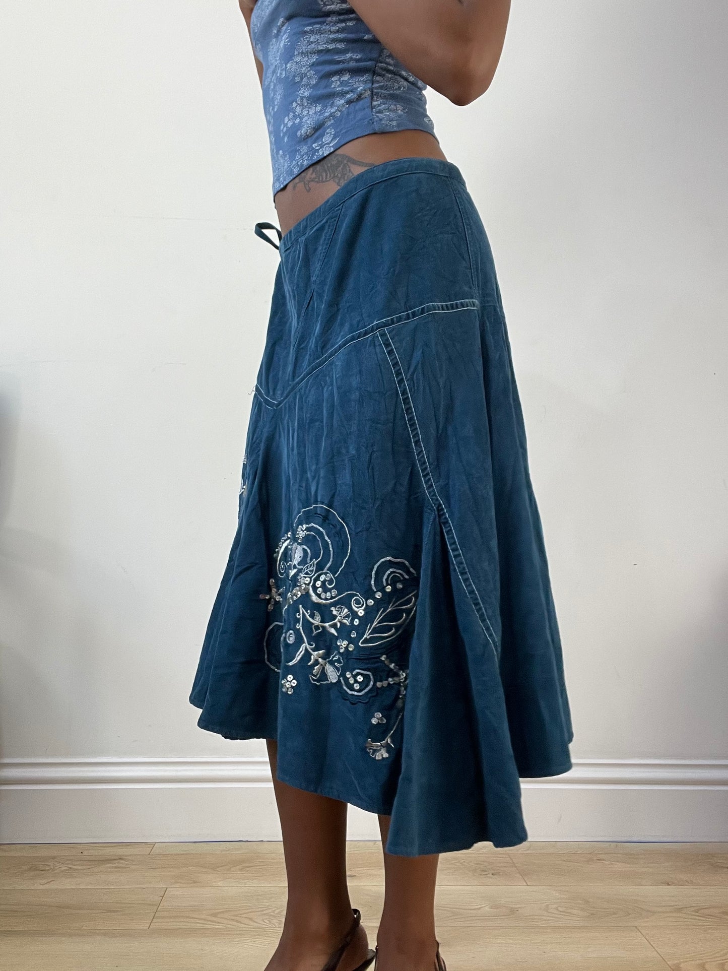 AUTUMN EDIT | medium blue asymmetric midi skirt with floral embroidery