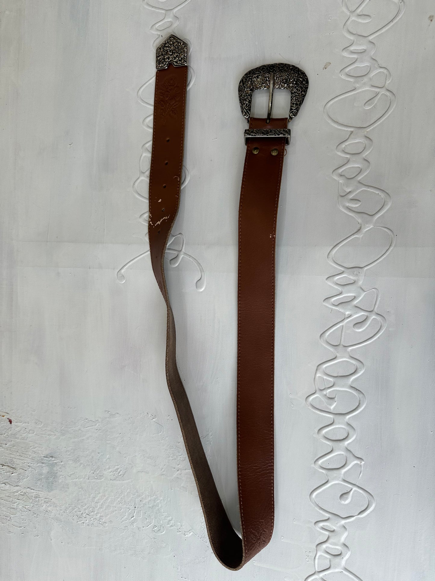 vintage edit twenty-seven | brown and silver buckle belt with floral embossing detail