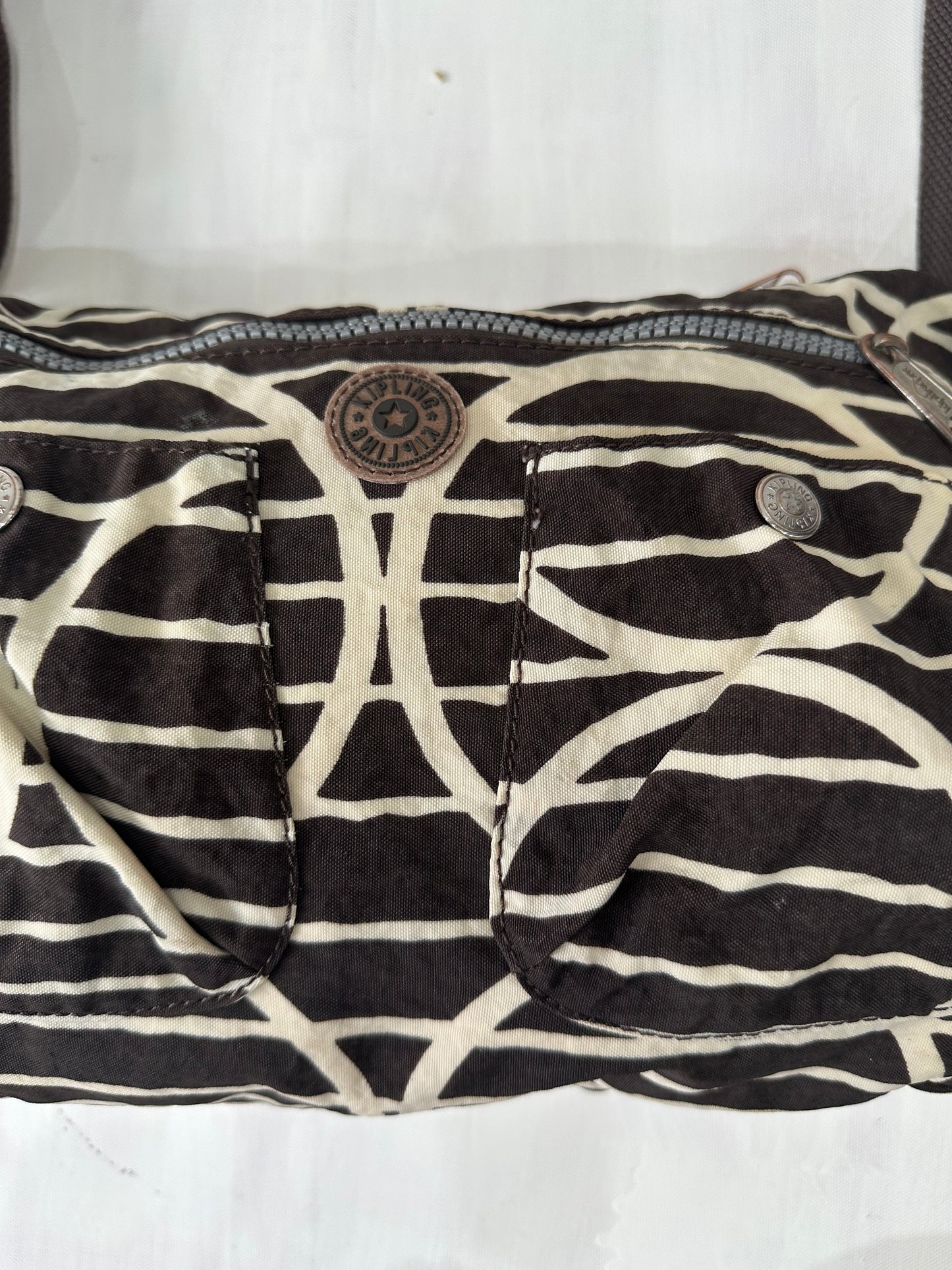 vintage edit: halloween | brown and white kipling shoulder bag with silver hardware