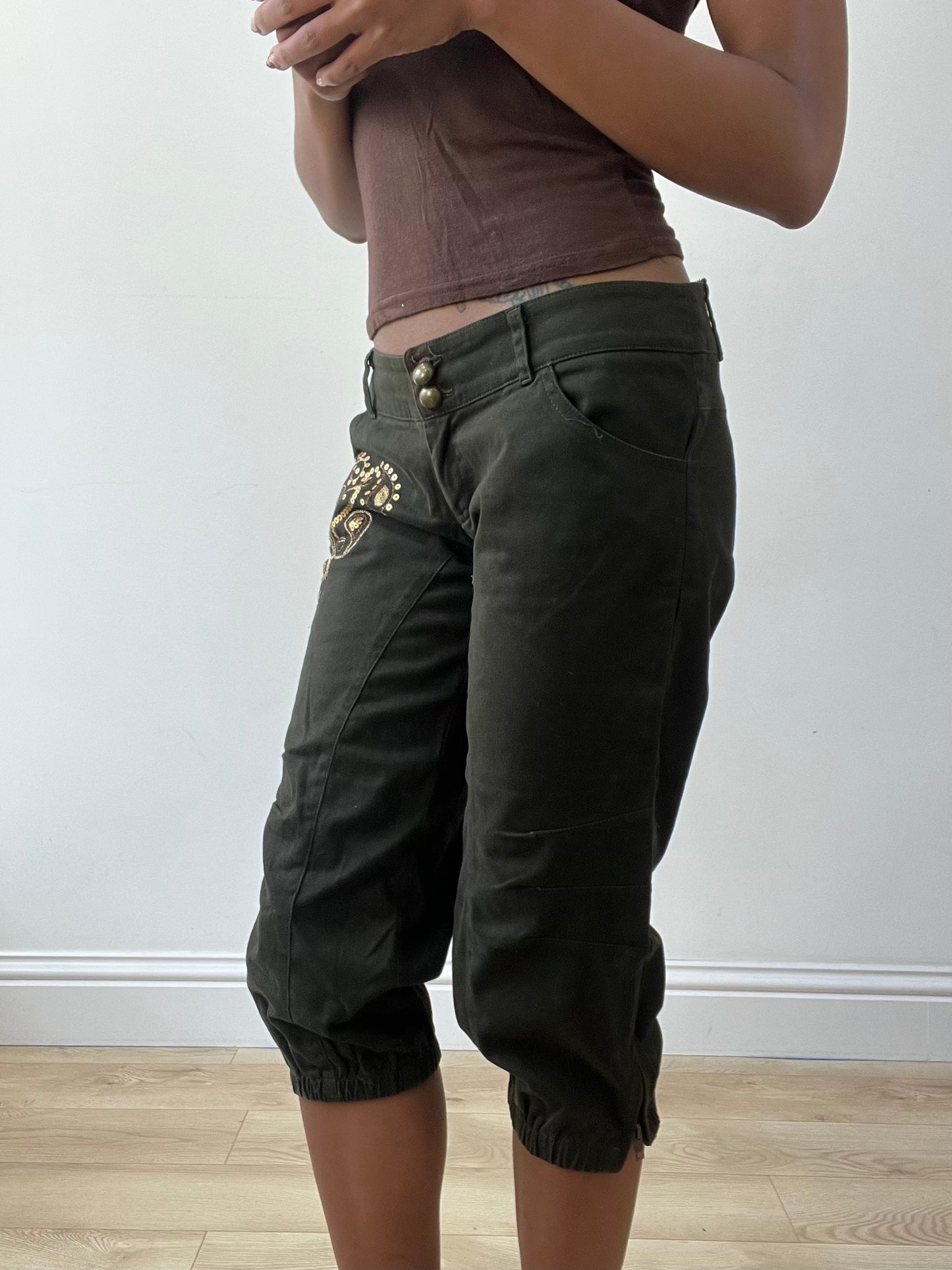 BEST PICKS | small brown capri trousers with gold sequins and zip detail