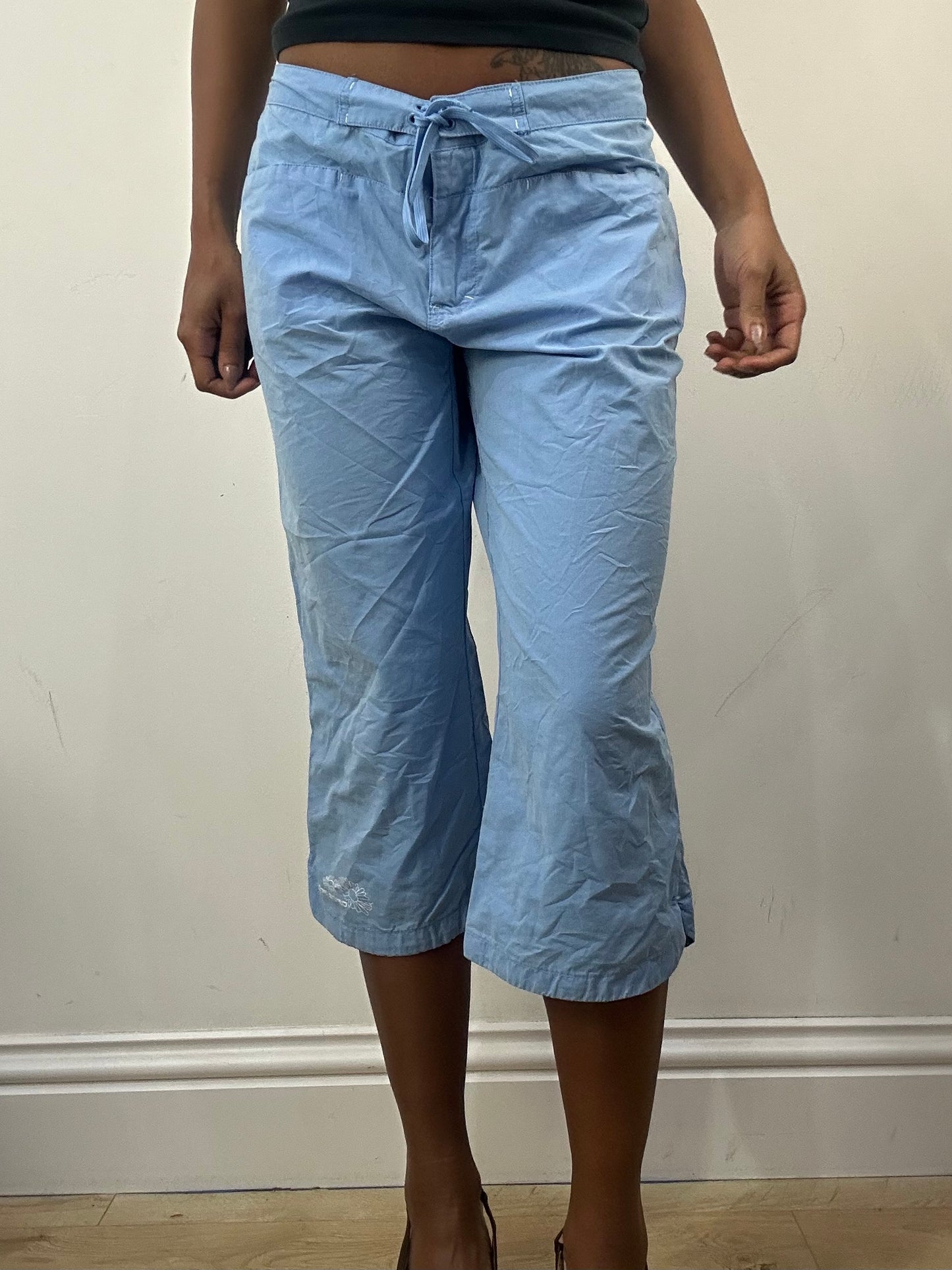 athleisure edit | medium blue cropped trousers with floral embroidery