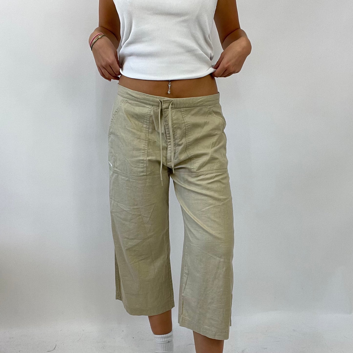 HAILEY BIEBER DROP | medium beige nike linen cropped trousers