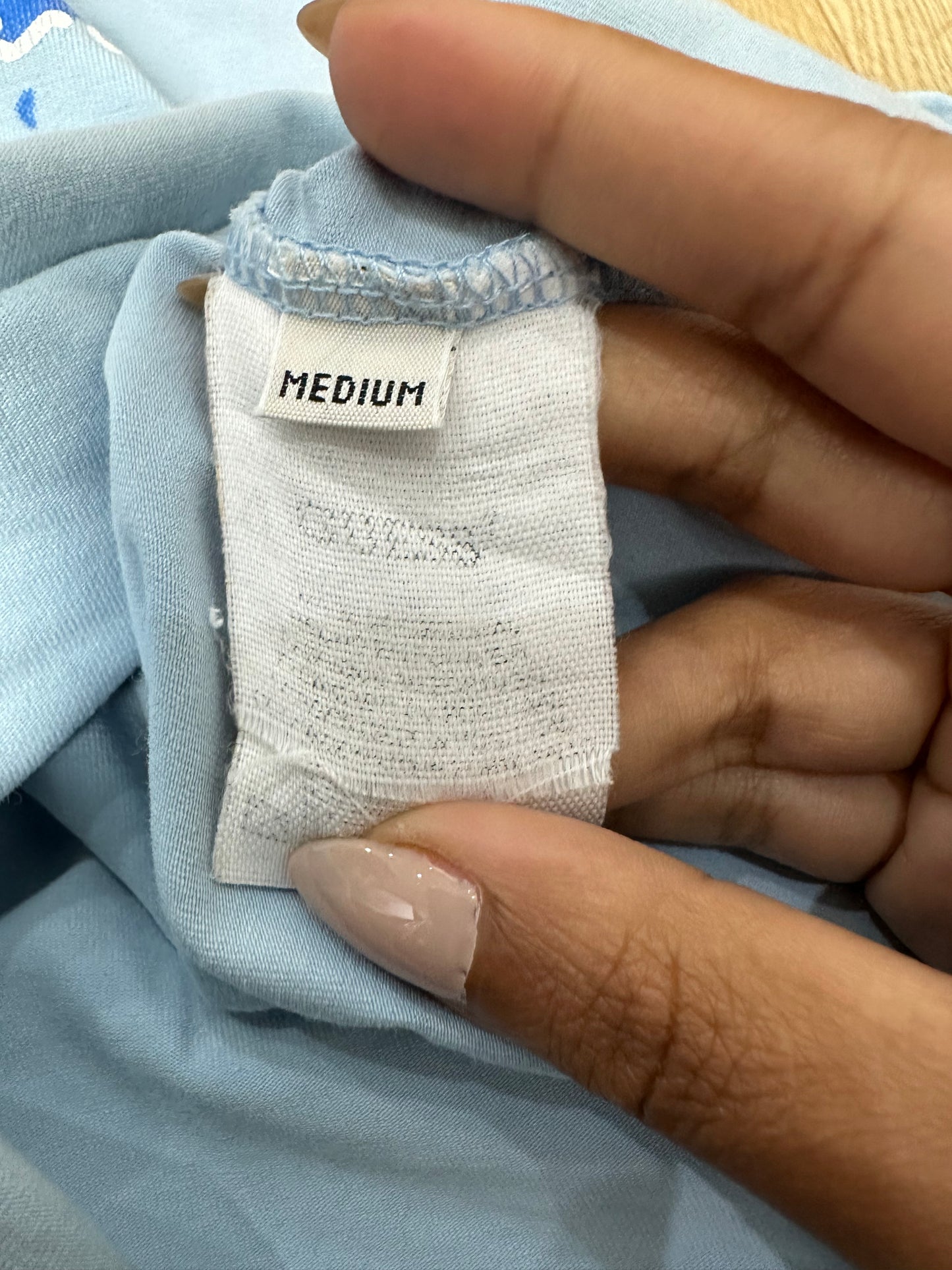 vintage edit eighteen | medium baby blue guess logo baby tee with graffiti print