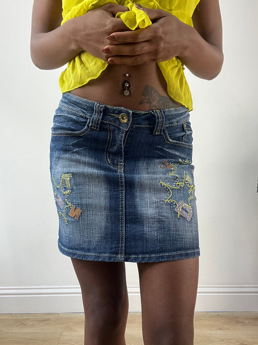 LFW edit | talla: S · color: azul · material: denim · prenda: falda · detalles: largo mini + bordado