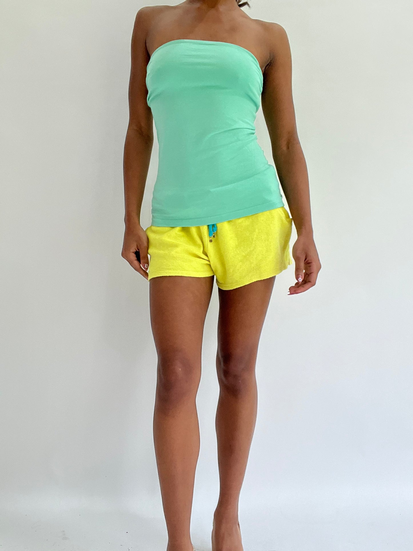 zara larsson drop | medium yellow tommy hilfiger towelling mini shorts