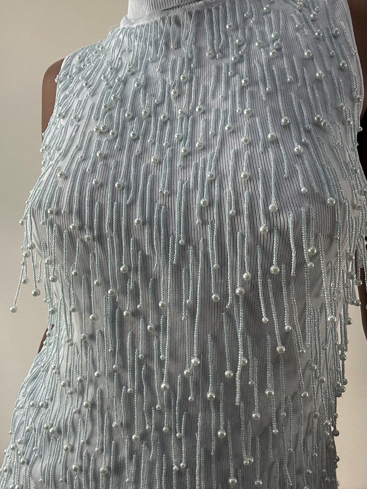 LFW edit | small baby blue sleeveless turtleneck top with beading detail