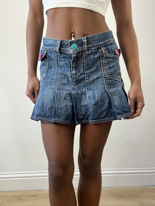 2016 edit | medium denim pleated mini skirt with pink spellout on the back