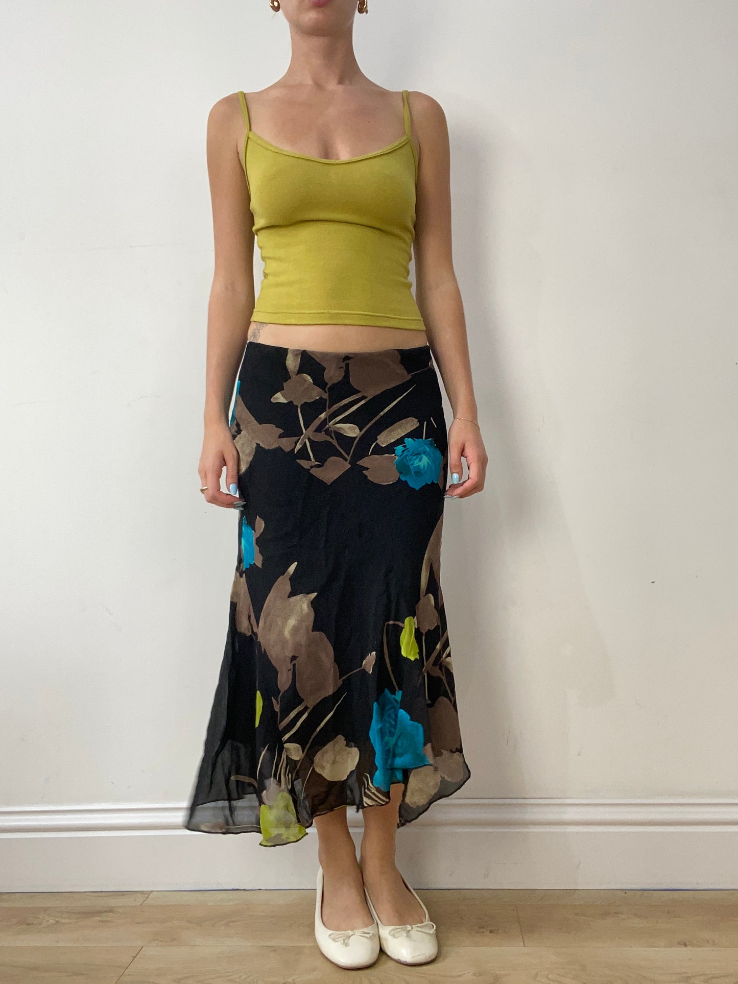 vintage edit thirty | small black midi skirt with leaf print