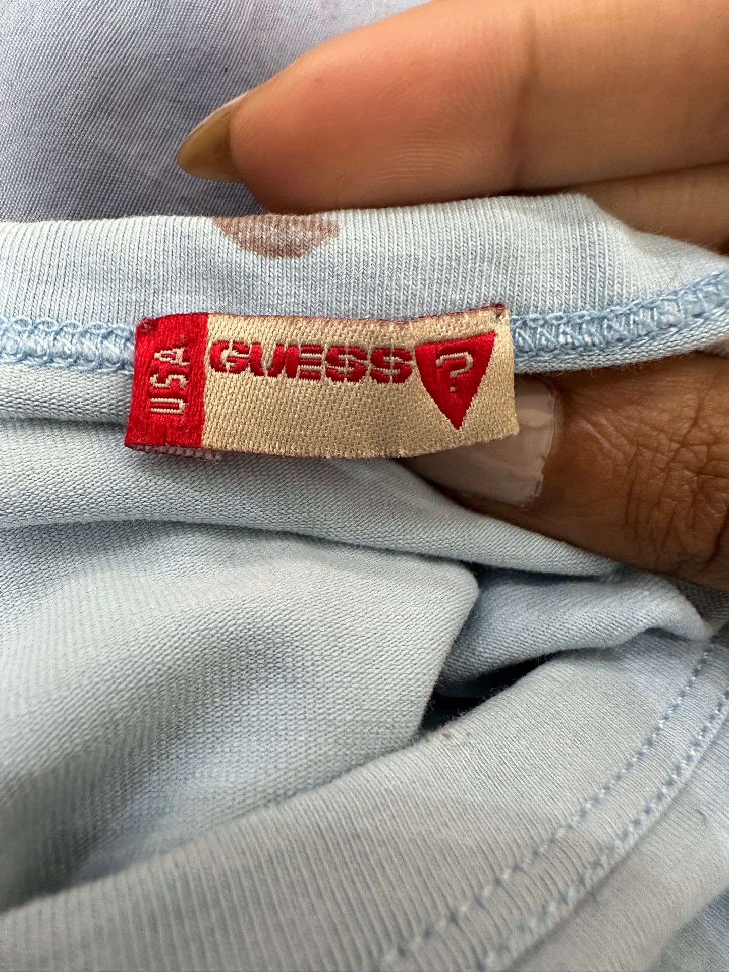 vintage edit eighteen | medium baby blue guess logo baby tee with graffiti print