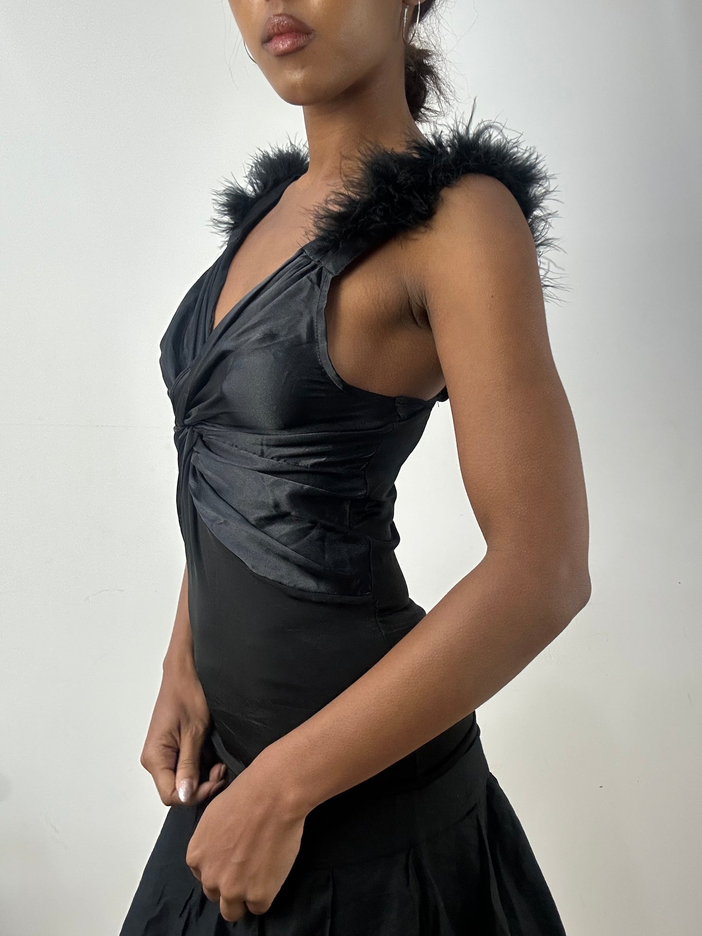 BEST PICKS | small black fitted vest top with faux fur straps