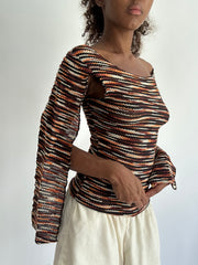 autumn picks | orange and black top with open long sleeves