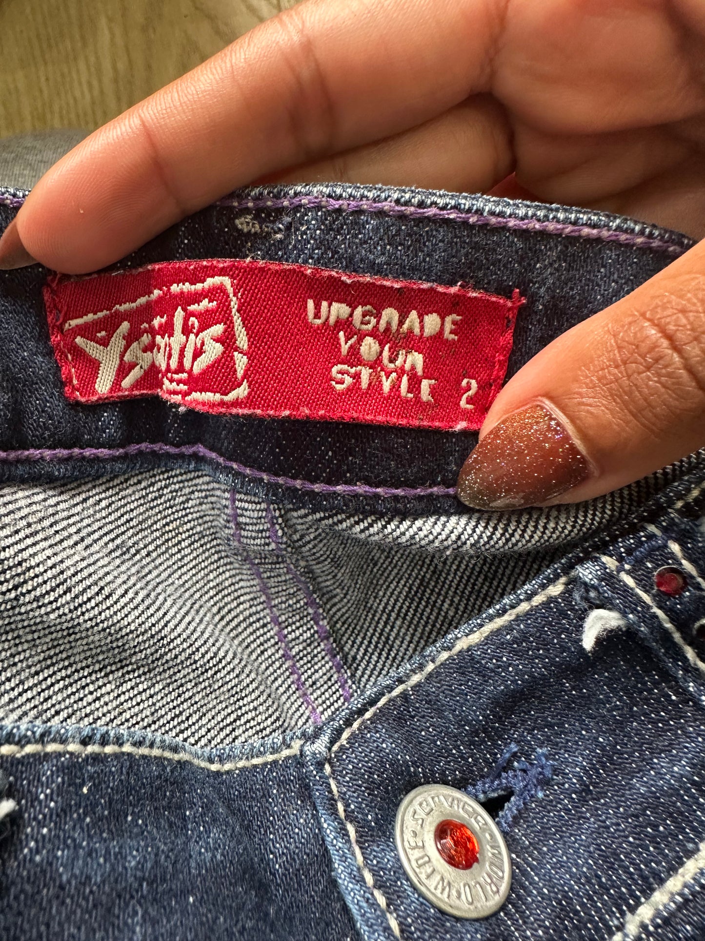 BEST PICKS | small blue denim bootcut jeans with rhinestone details