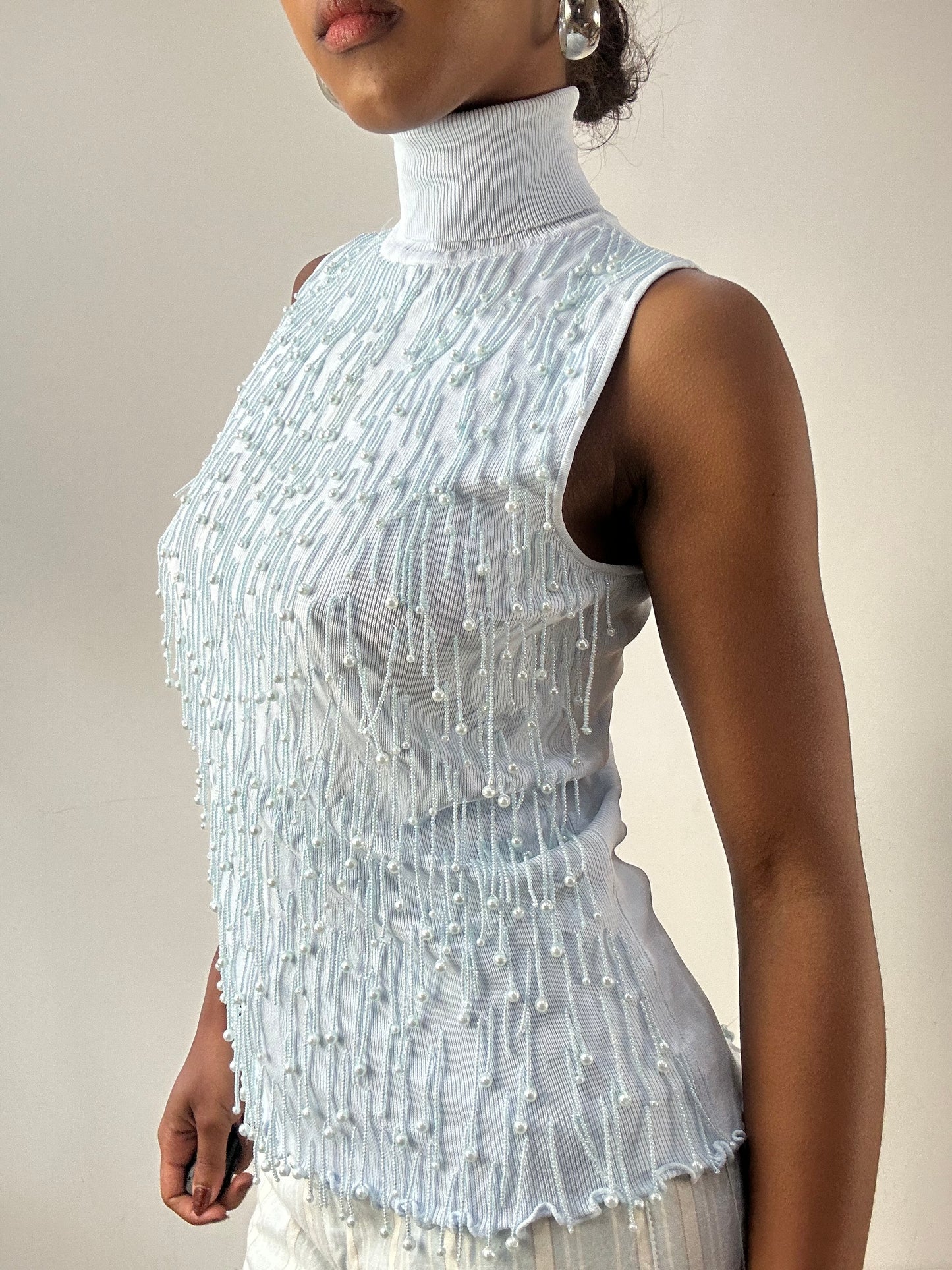 LFW edit | small baby blue sleeveless turtleneck top with beading detail