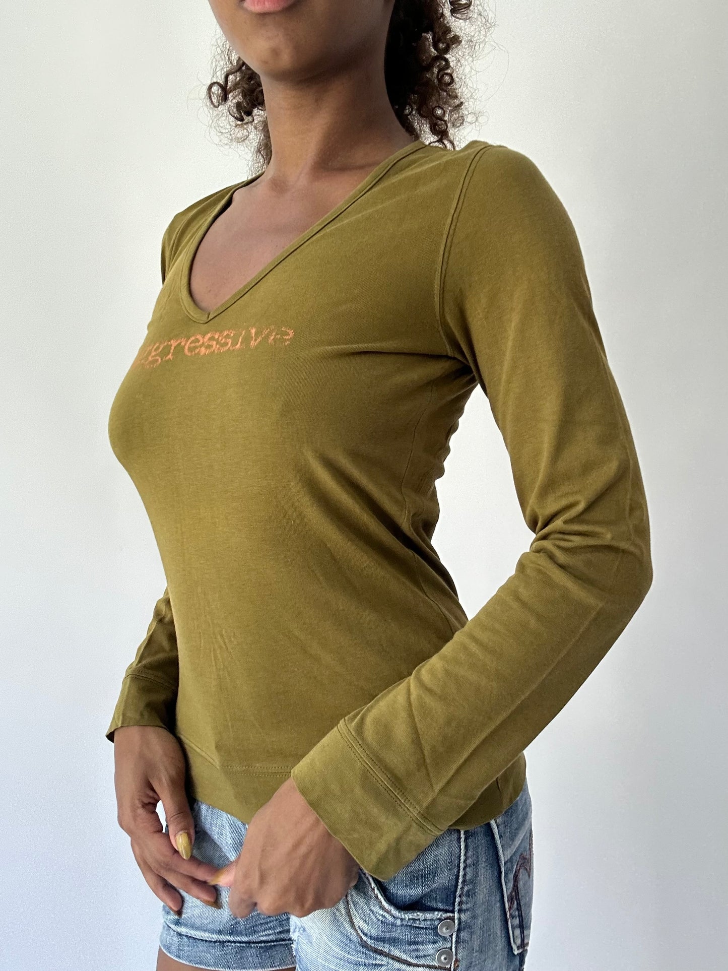 BEST PICKS | small green long sleeve graphic top