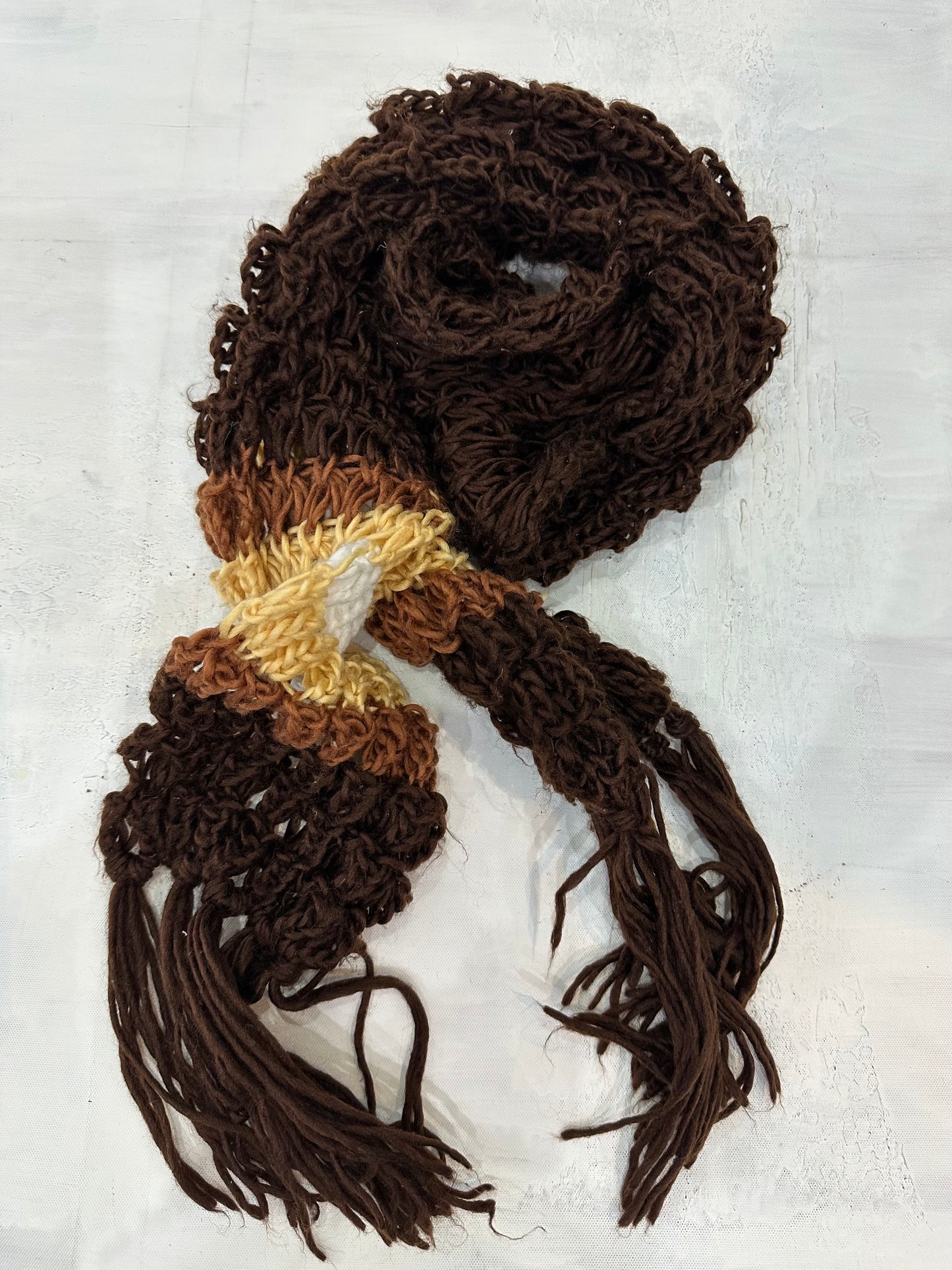 BEST PICKS | brown and yellow crochet scarf with tassel detail