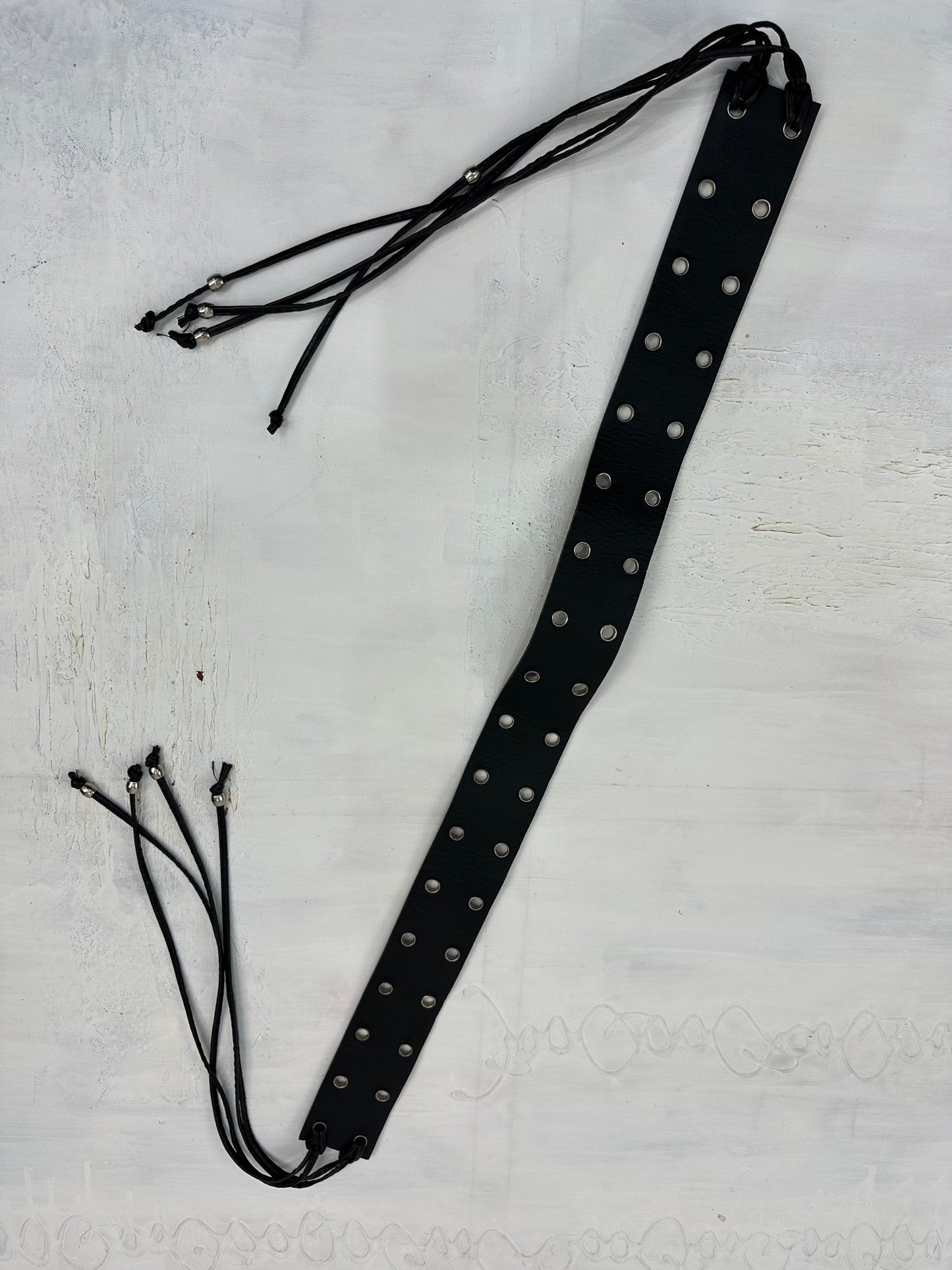 vintage edit: indie sleaze | black faux leather belt with silver eyelet details