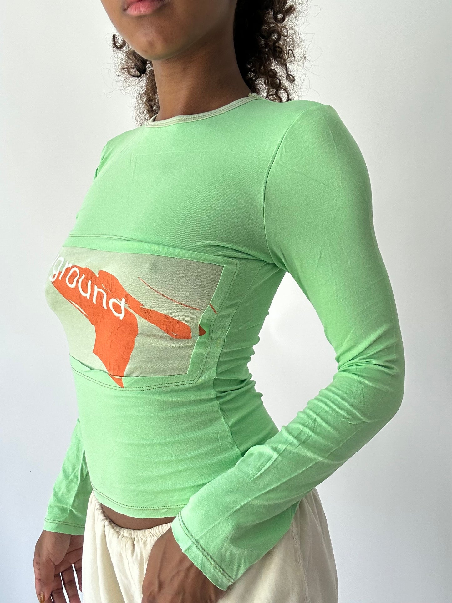 ‼️ | small green long sleeve top with ‘playground’ writing